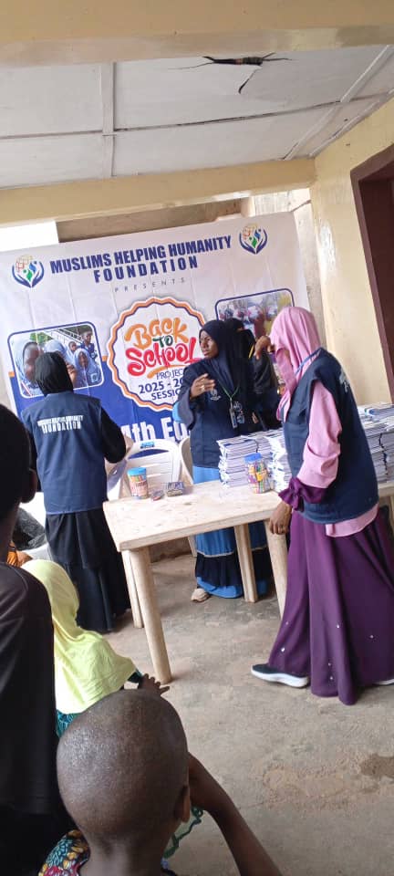 Orphans receiving school supplies